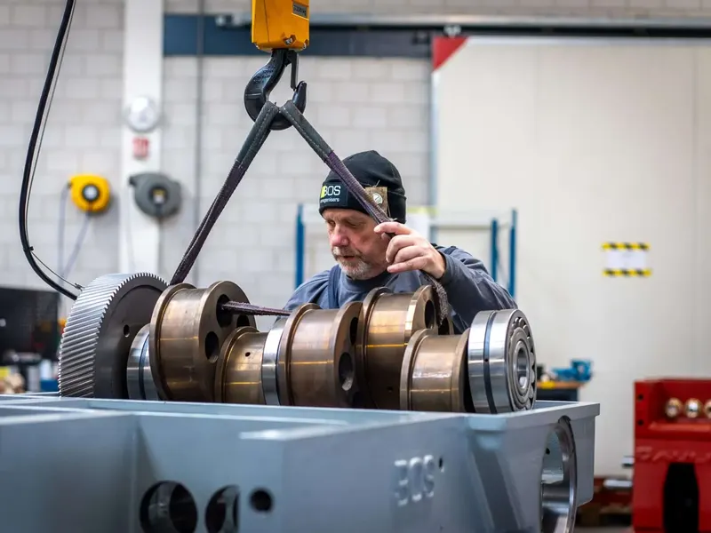 BOS service engineer fitting a crankshaft into a homogeniser drive housing