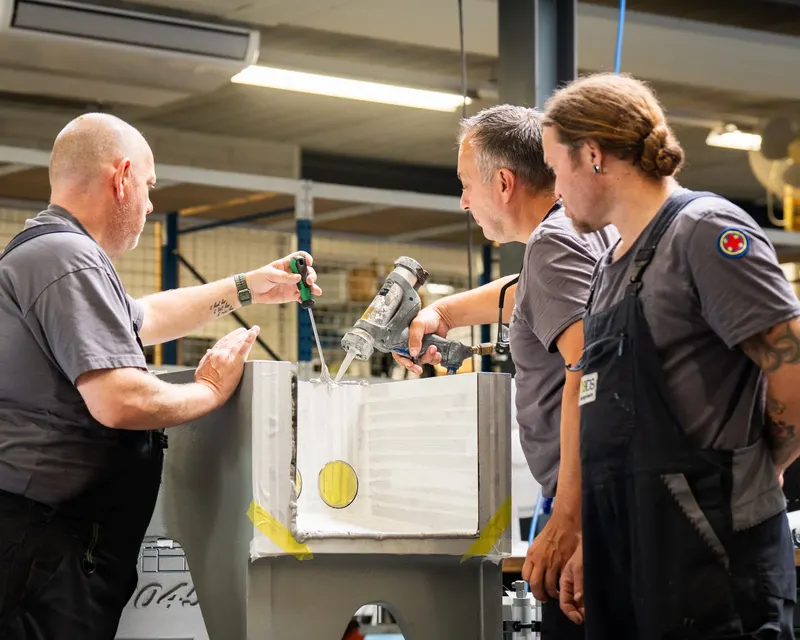BOS technician working on homogeniser components in the workshop